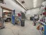 Garage featuring a workshop area and a heating unit
