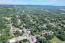 View of property location with nearby suburban area