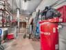 Utility room featuring a heating unit