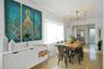 Dining area featuring polished terrazzo flooring, large-scale window with floor-length drapery, and multi-arm chandelier lighting