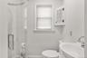 Bathroom with a shower stall and a sink