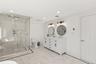 Bathroom with a marble finish shower, double vanity, recessed lighting, and ornamental molding