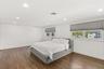 Bedroom with recessed lighting, wood finished floors, and ornamental molding