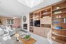 View of built-ins and gas fireplace in family room