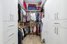 Primary walk-in closet with custom built-ins