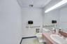 Second restroom with existing fixtures.