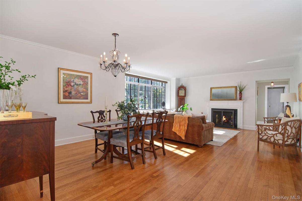 Open dining room and living room with views of the river