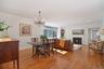 Open dining room and living room with views of the river