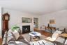 Living room with wood burning fireplace