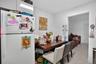 Kitchen featuring white cabinetry and terrazzo flooring