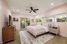 Wood-finish flooring, recessed lighting, ceiling fan, and sliding glass door with exterior balcony access