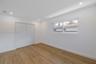 Neutral interior featuring wood-finish flooring, recessed lighting, and a double-door closet