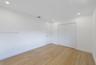 Interior room featuring wood-finish flooring, recessed lighting, and a double-door closet
