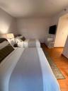 Wood-finish flooring throughout, smooth wall surfaces, and neutral paint palette