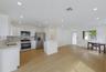 Kitchen featuring white cabinetry, stone countertops, stainless steel appliances, recessed lighting, and wood-finish flooring