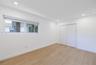 Interior space featuring wood-finish flooring, recessed lighting, a horizontal sliding window, and a built-in closet with double-panel doors