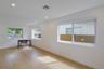 Interior space featuring light wood-finish flooring, recessed lighting, and multiple sliding windows