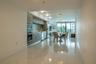 Kitchen featuring horizontal-grain cabinetry, stainless steel wall oven and microwave, mosaic tile backsplash, and floor-to-ceiling glass panel window