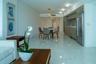 Kitchen featuring horizontal-grain wood cabinetry, stainless steel refrigerator, mosaic tile backsplash, and light-toned stone-finish floor tiling, co