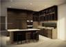 Modern kitchen featuring dark wood-finish cabinetry, floor-to-ceiling integrated appliance paneling, recessed lighting, stone-finish countertops, and 