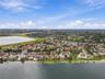 Aerial perspective of waterfront property featuring direct shoreline access and expansive lake exposure