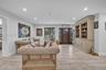 Interior space featuring wood-finish flooring, recessed lighting, and a stained wood front door with sidelights