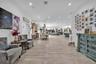 Open-concept interior featuring light wood-finish flooring, recessed lighting, and high ceilings