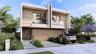Contemporary two-story exterior featuring a wood-panel facade, floor-to-ceiling glass doors, upper-level balconies with glass railings, and a concrete