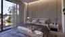 Floor-to-ceiling glass sliding doors, textured accent wall with vertical inlay detail, matte black pendant lighting, and neutral-tone tile flooring