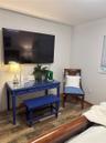 Wood-finish flooring and window with integrated blinds