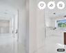 Interior featuring structural columns, polished stone flooring, recessed lighting, white shaker-style cabinetry, and integrated kitchen appliances