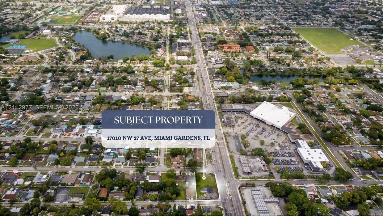 Aerial perspective of corner lot property featuring direct frontage on NW 27th Avenue in Miami Gardens