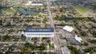 Aerial perspective of corner lot property featuring direct frontage on NW 27th Avenue in Miami Gardens