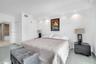 Spacious room featuring polished tile flooring, recessed ceiling lighting, and a neutral color palette