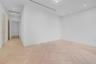 Interior space featuring light-toned wood-finish flooring in a herringbone pattern, recessed lighting, and smooth-finish white walls