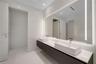 Floating dual-sink vanity featuring square vessel basins, quartz countertop, large wall-to-wall integrated LED vanity mirror, and polished chrome fixt