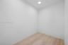 Neutral-toned interior space featuring light-colored wood-finish flooring and recessed ceiling lighting