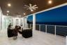 Covered patio featuring large-format tile flooring, a slatted wood-finish ceiling with recessed lighting, dual ceiling fans, and white horizontal-bar 
