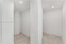 Interior space featuring neutral wall tones, recessed lighting, and wood-finish flooring