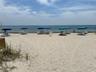 Sandy beach frontage featuring native dune grasses and direct access to the ocean