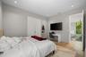 Wood-finish flooring, recessed lighting, and dual-panel interior doors
