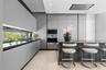 Modern kitchen featuring matte grey flat-panel cabinetry, dark stone countertops, built-in stainless steel appliances, a horizontal window backsplash,