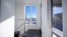 Expansive windows, wood-finish flooring, and stainless steel cable railing system