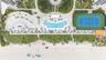 Oceanfront grounds featuring a swimming pool, hard-court tennis court, landscaped gardens, and paved recreation terrace