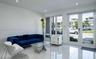 Interior space featuring large-format tile flooring, recessed lighting, expansive multi-pane windows, and glass-paneled double entry doors