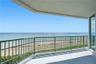Expansive oceanfront balcony with breathtaking views of the Atlantic Ocean and sandy beach below.