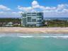 Stunning aerial view of Regency Island Dunes, perfectly positioned along the pristine beaches of Hutchinson Island with the Intracoastal Waterway to t