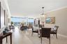 Open-concept living and dining spaces offer comfortable coastal living with plenty of natural light.
