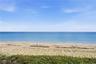 Enjoy breathtaking views of the Atlantic Ocean and pristine sandy beach, with beautiful blue water stretching to the horizon.