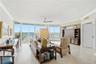 Bright, spacious living room featuring floor-to-ceiling glass and spectacular direct ocean views.